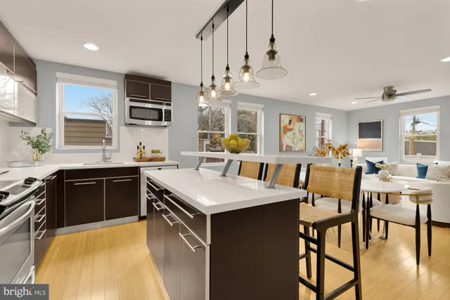 a large kitchen with a table and chairs