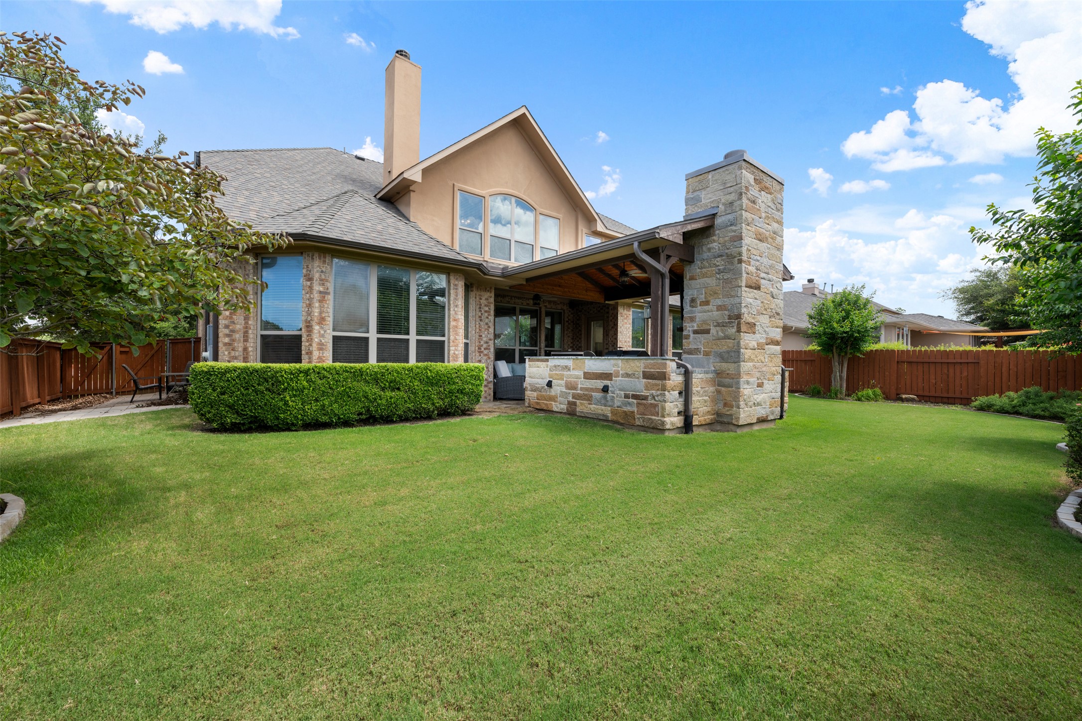 3021 Wedgescale Pass Leander, TX 78641 - Photo 30 of 40 a front view of a house with a garden