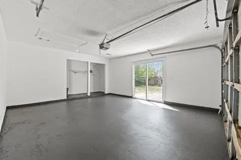 a view of a livingroom with wooden floor and window