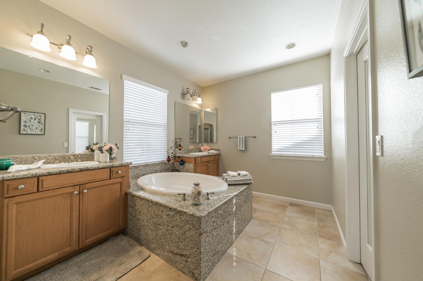 3830 Highbury Way San Ramon, CA 94582 - Photo 25 of 38 a bathroom with a tub sink and mirror