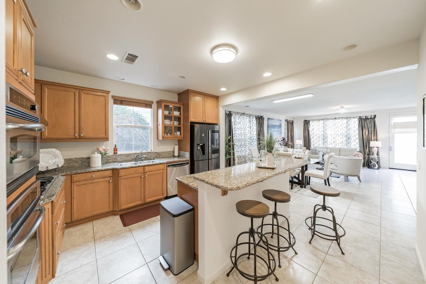 3830 Highbury Way San Ramon, CA 94582 - Photo 8 of 38 a kitchen with stainless steel appliances kitchen island granite countertop a sink and cabinets