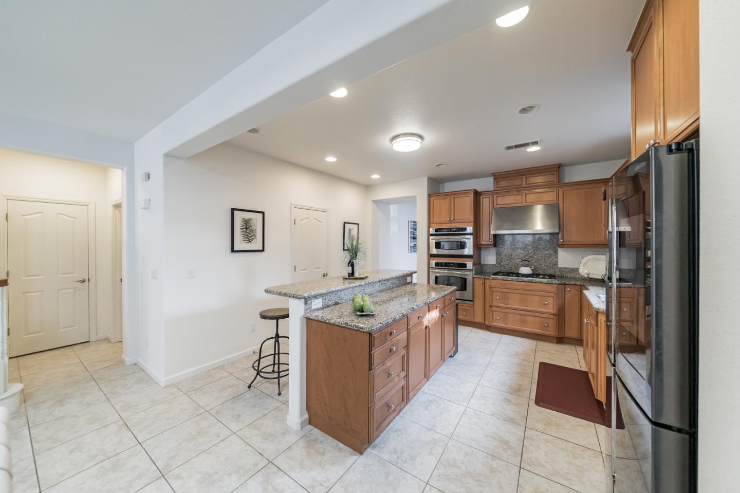 3830 Highbury Way San Ramon, CA 94582 - Photo 9 of 38 a kitchen with stainless steel appliances granite countertop a refrigerator and a stove