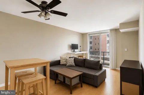 a living room with furniture and a window