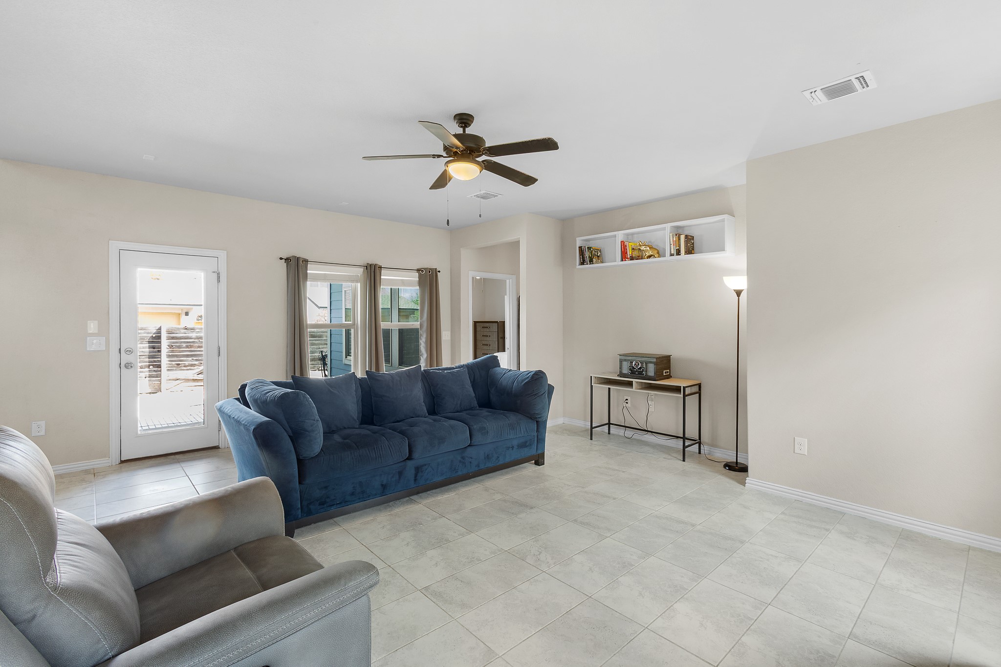8709 Slater Drive Austin, TX 78747 - Photo 12 of 36 a living room with furniture and a window
