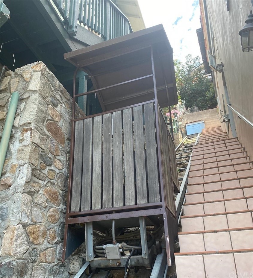 183 Lower Terrace Road Avalon, CA 90704 - Photo 3 of 33 a balcony with table and chairs
