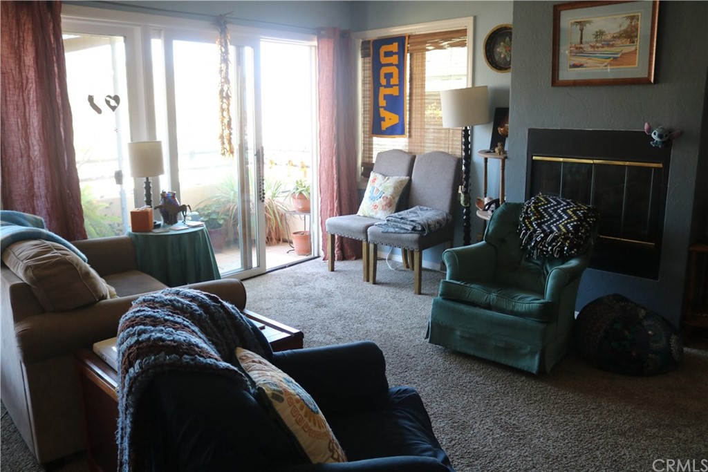 183 Lower Terrace Road Avalon, CA 90704 - Photo 5 of 33 a living room with furniture and a large window