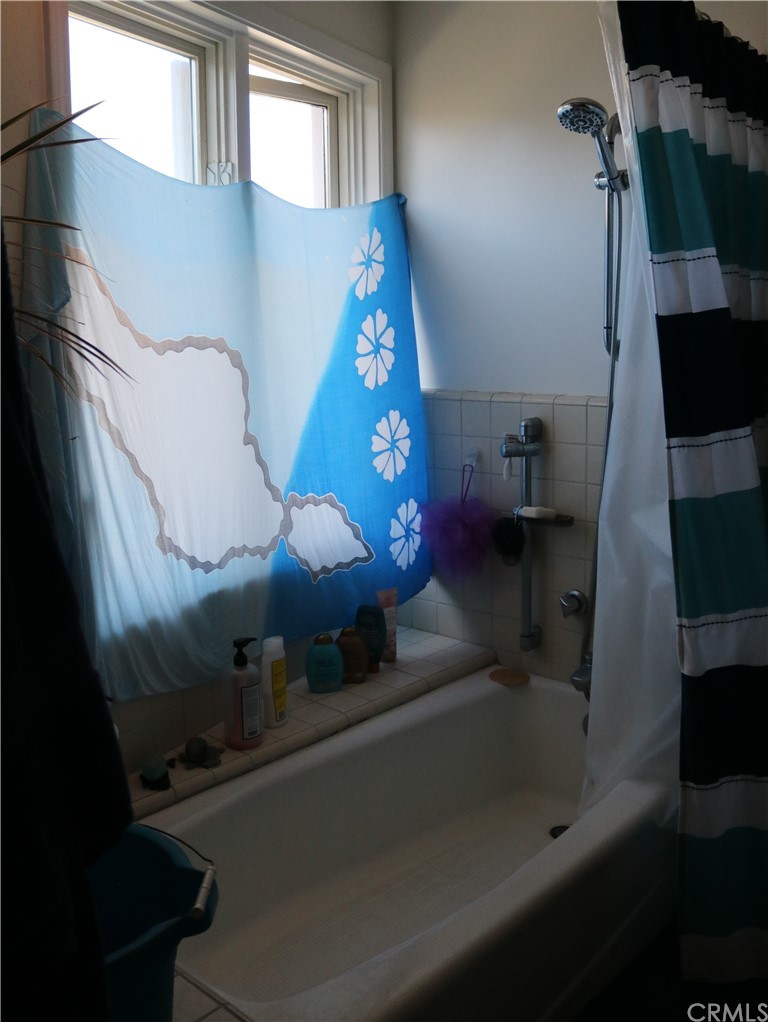 183 Lower Terrace Road Avalon, CA 90704 - Photo 8 of 33 a bathroom with a sink and mirror