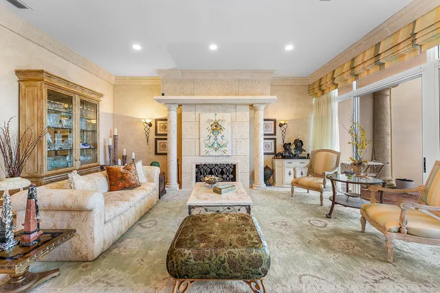 a living room with furniture large window and rug