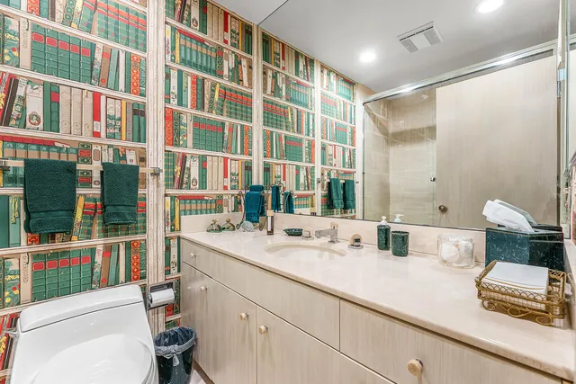 a en suite bathroom with a sink a toilet and shower