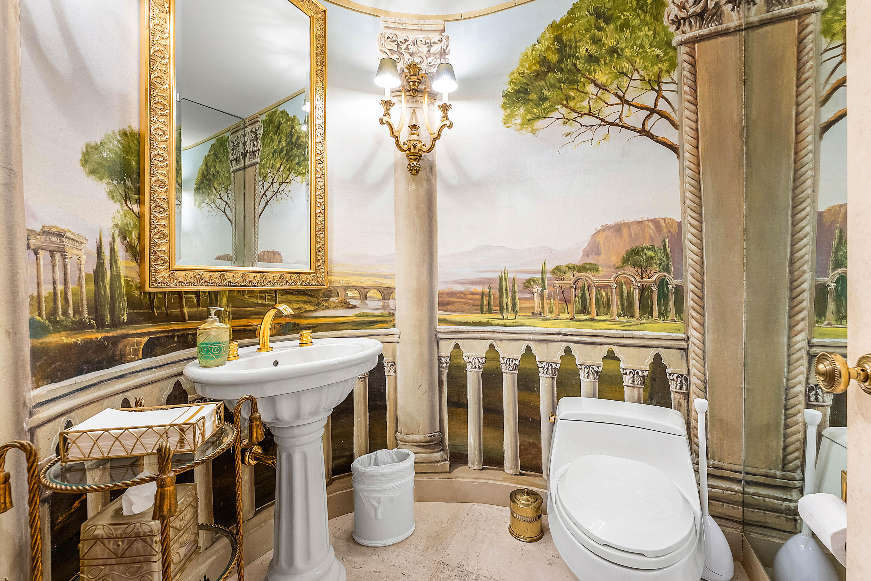 13 Sloans Curve Drive, Unit 13 Palm Beach, FL 33480 - Photo 18 of 47 a bathroom with a sink a toilet and a shower curtain