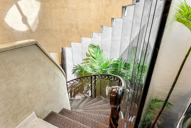 a vase of flowers sitting next to a window