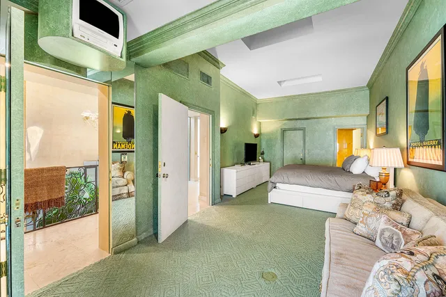 a balcony with furniture and a chandelier