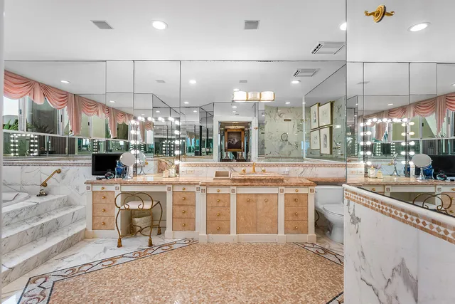 a large kitchen with a lot of counter space and a sink