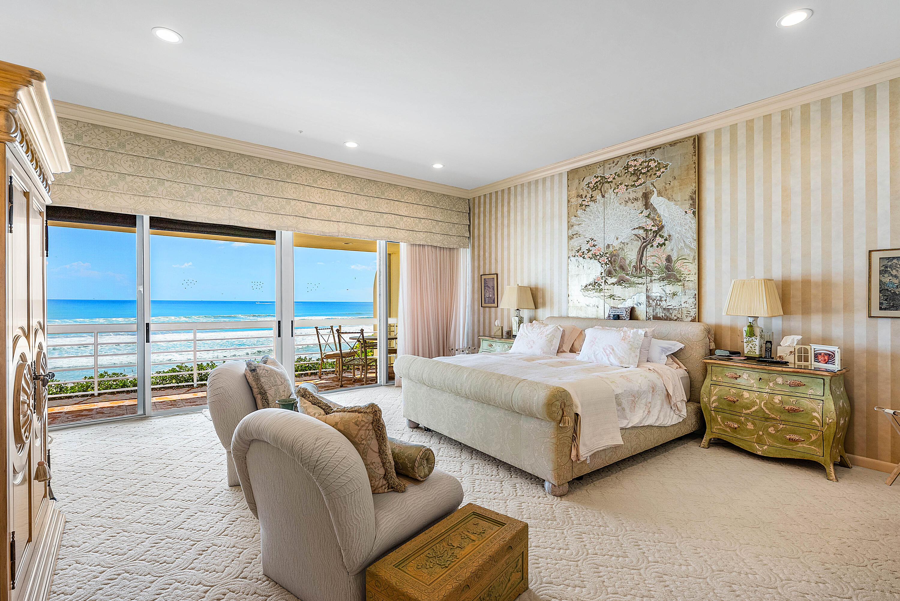 13 Sloans Curve Drive, Unit 13 Palm Beach, FL 33480 - Photo 29 of 47 a spacious bedroom with a bed and glass walk in closet