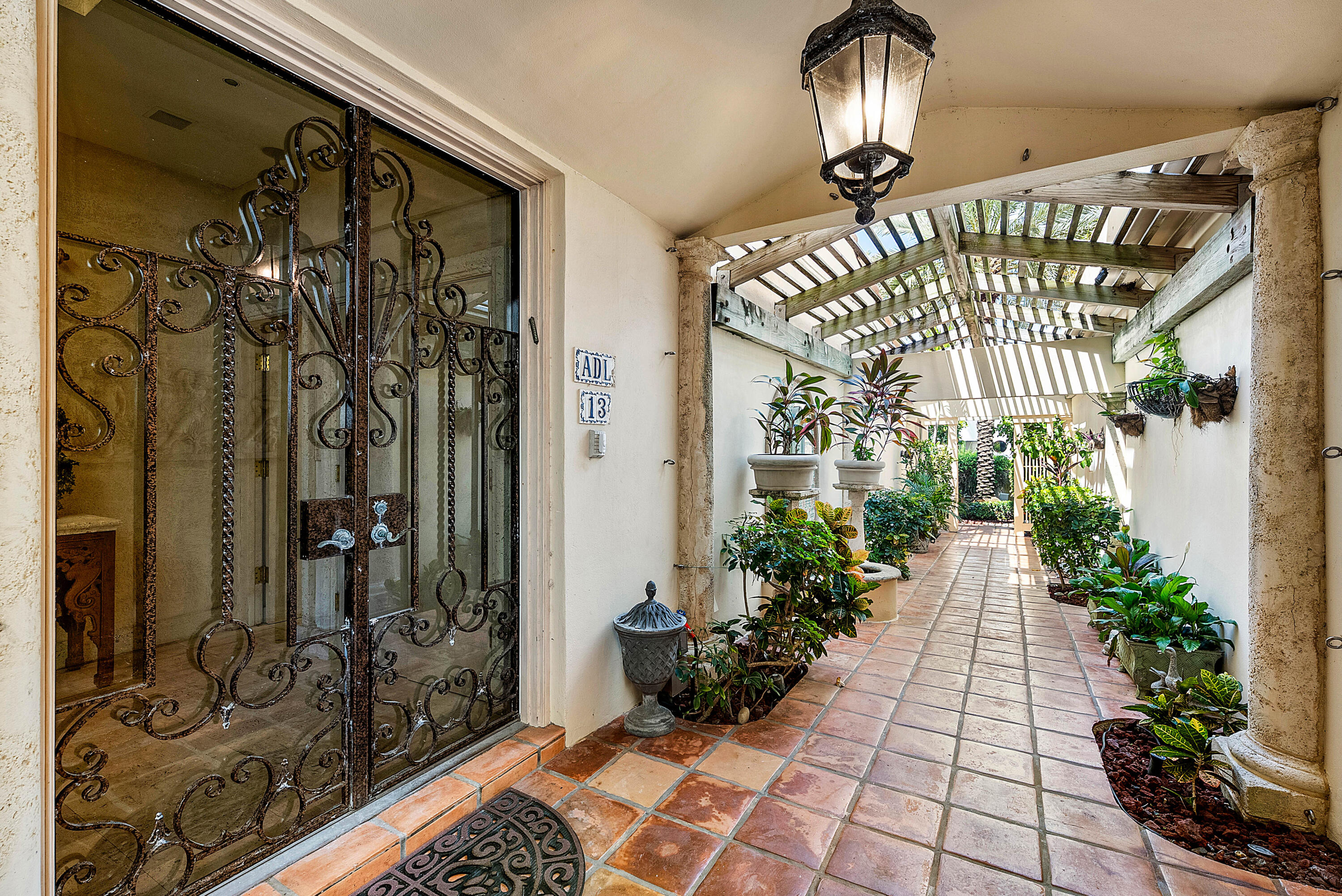 13 Sloans Curve Drive, Unit 13 Palm Beach, FL 33480 - Photo 3 of 47 a view of entryway with a front door