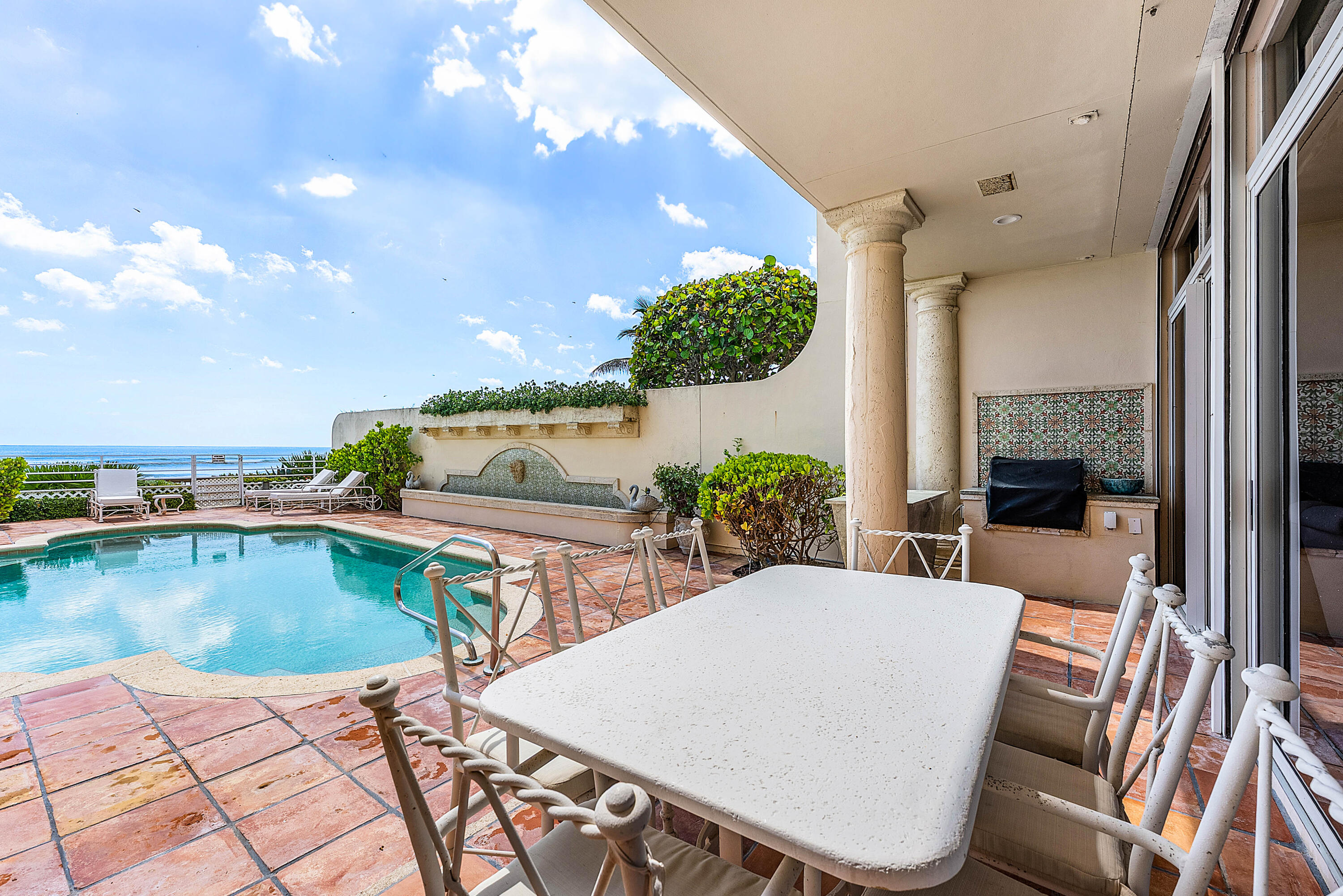 13 Sloans Curve Drive, Unit 13 Palm Beach, FL 33480 - Photo 33 of 47 swimming pool view with a seating space