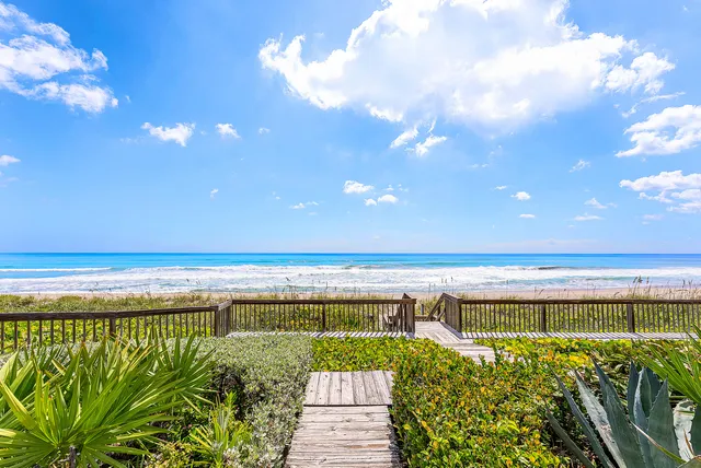 a view of a swimming pool and an outdoor seating