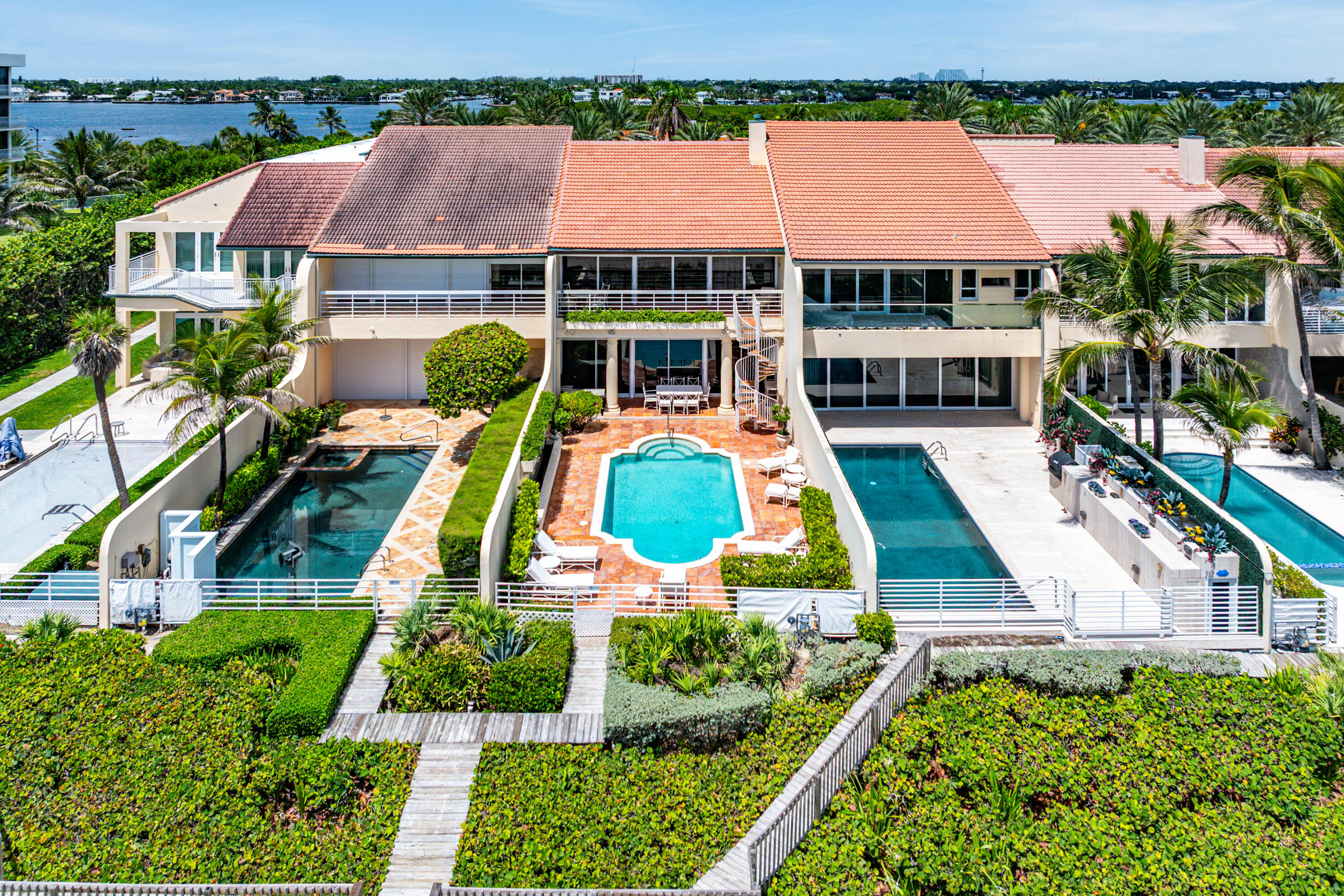 13 Sloans Curve Drive, Unit 13 Palm Beach, FL 33480 - Photo 37 of 47 an aerial view of multiple houses with swimming pool