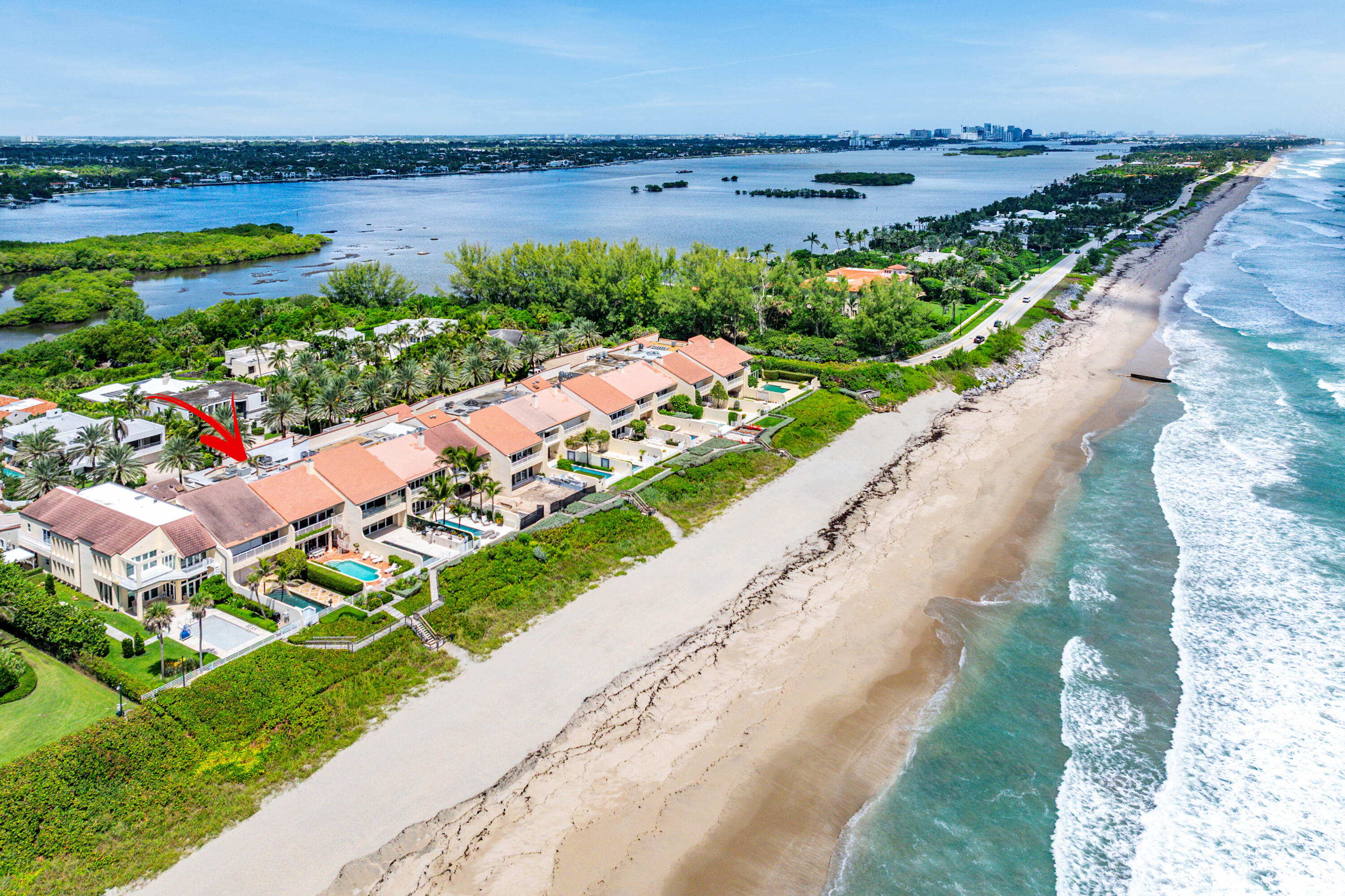 13 Sloans Curve Drive, Unit 13 Palm Beach, FL 33480 - Photo 38 of 47 a view of a lake with a city