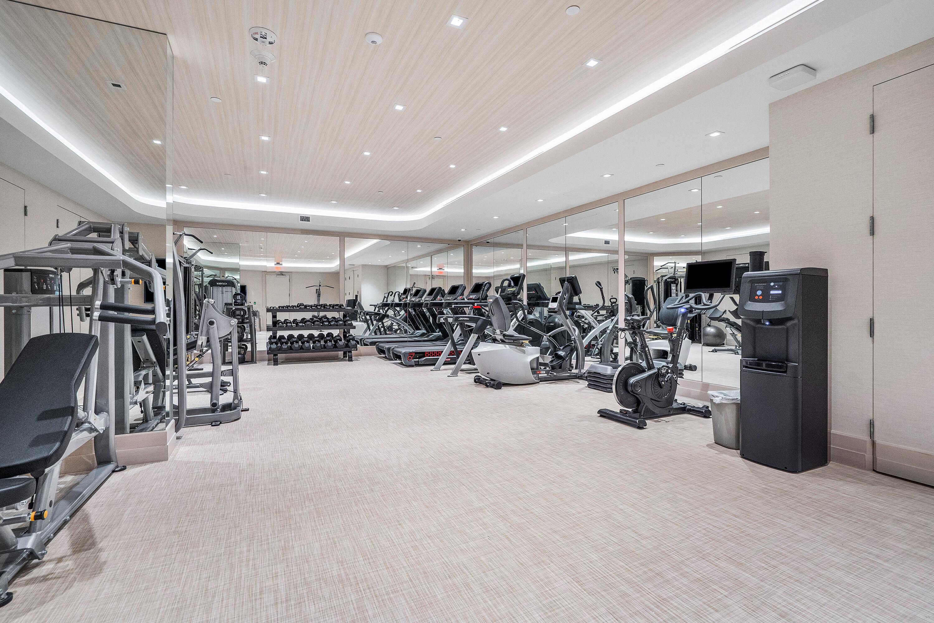 13 Sloans Curve Drive, Unit 13 Palm Beach, FL 33480 - Photo 41 of 47 a view of a room with gym equipment