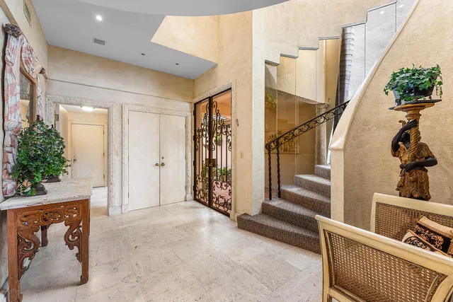 a view of entryway with wooden floor and stairs