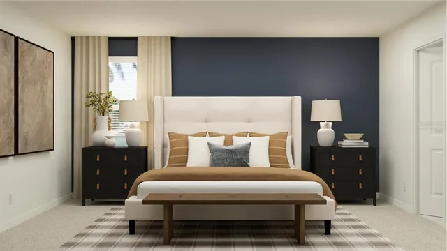 a bedroom with a bed and a lamp