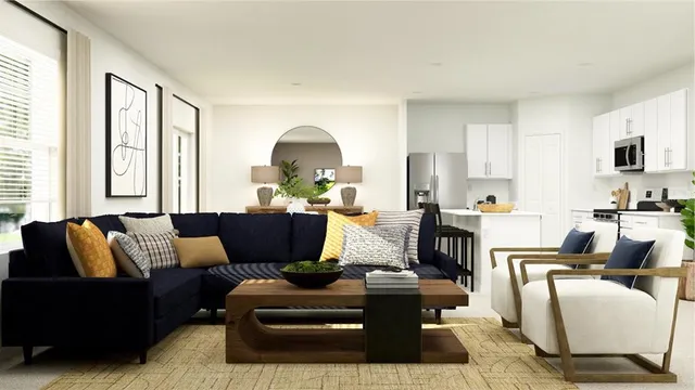 a living room with furniture fireplace and a large window