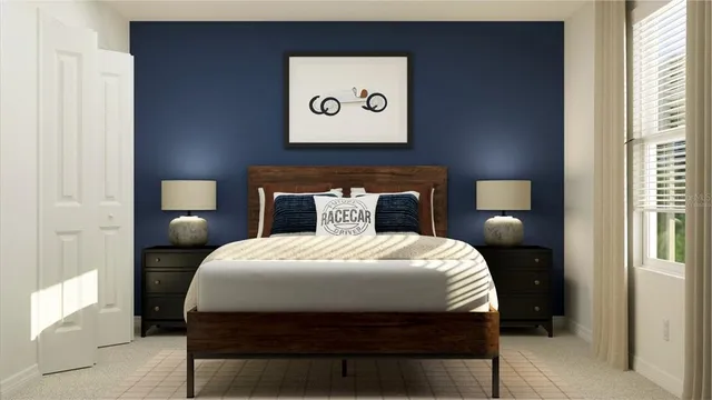 a bedroom with a bed and a lamp on dresser