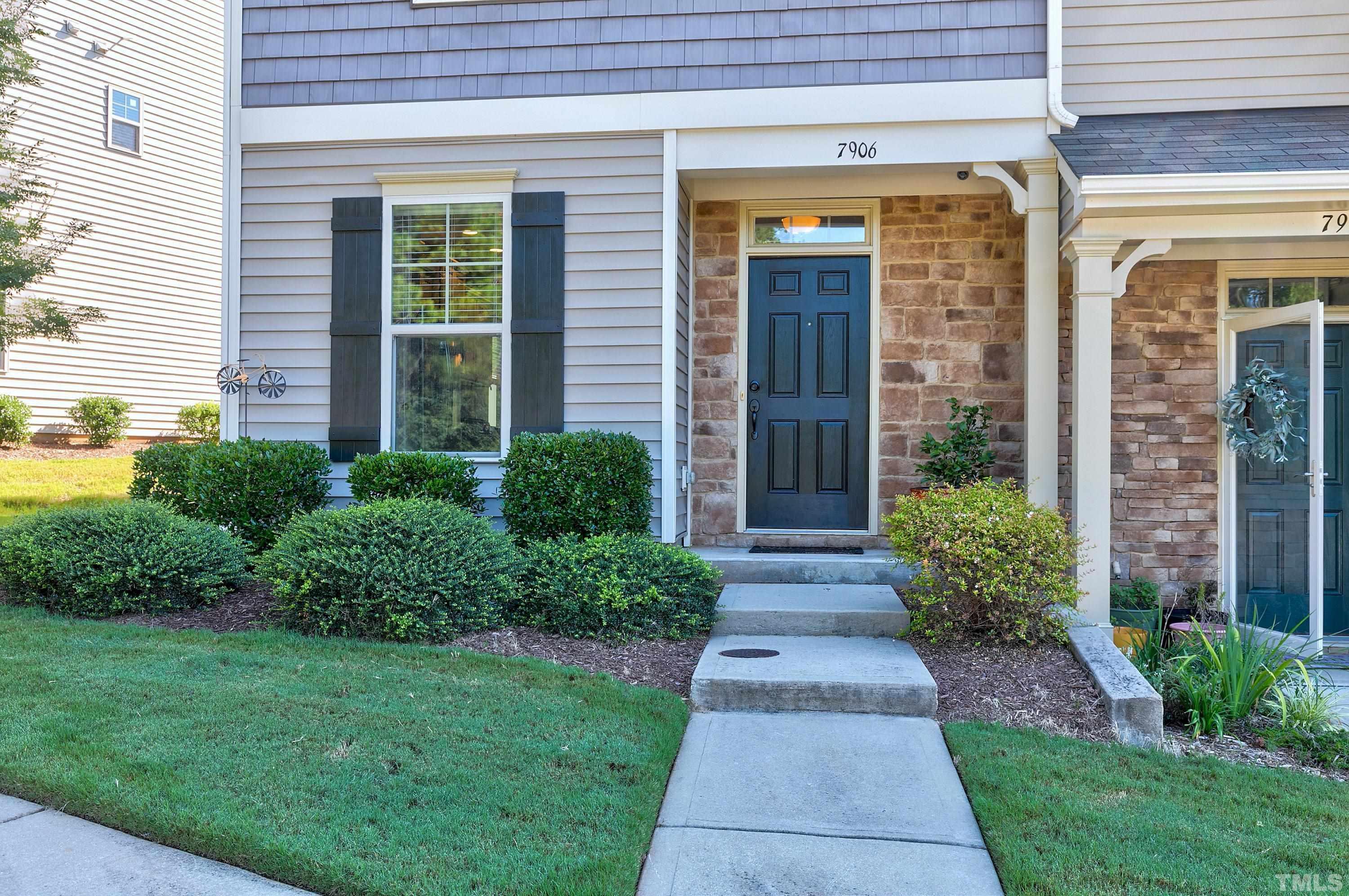 7906 Allscott Way Raleigh, NC 27612 - Photo 2 of 30 a front view of a house with garden