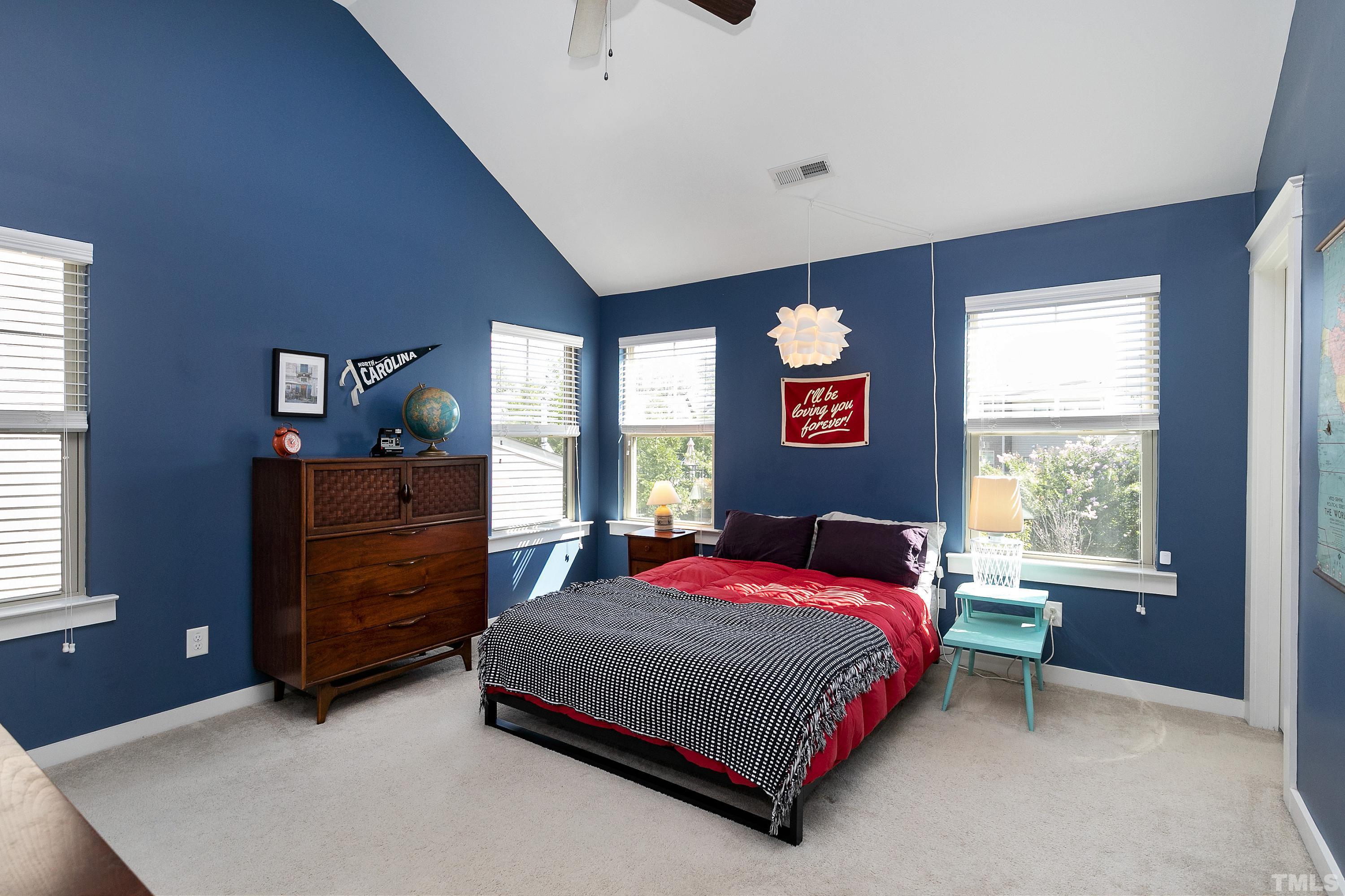 7906 Allscott Way Raleigh, NC 27612 - Photo 16 of 30 a bedroom with a bed and a dresser