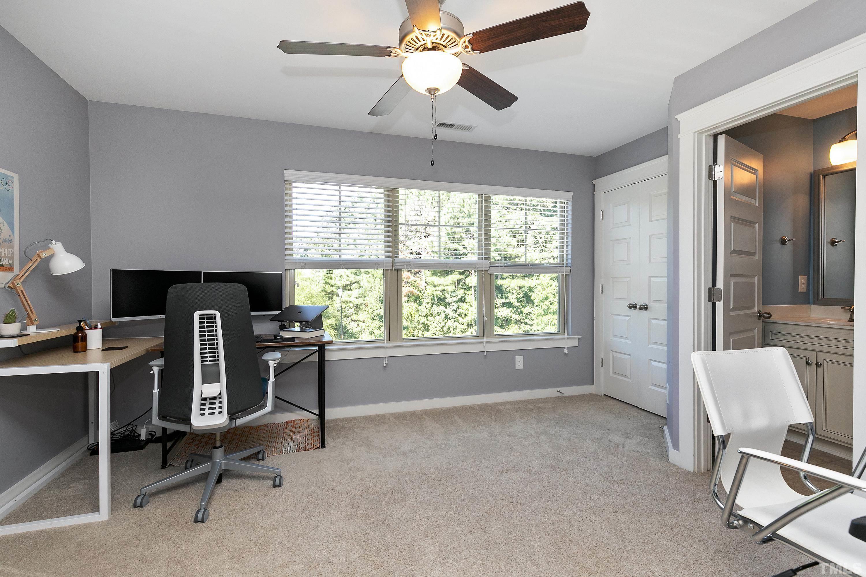 7906 Allscott Way Raleigh, NC 27612 - Photo 21 of 30 a view of a workspace with furniture and a window