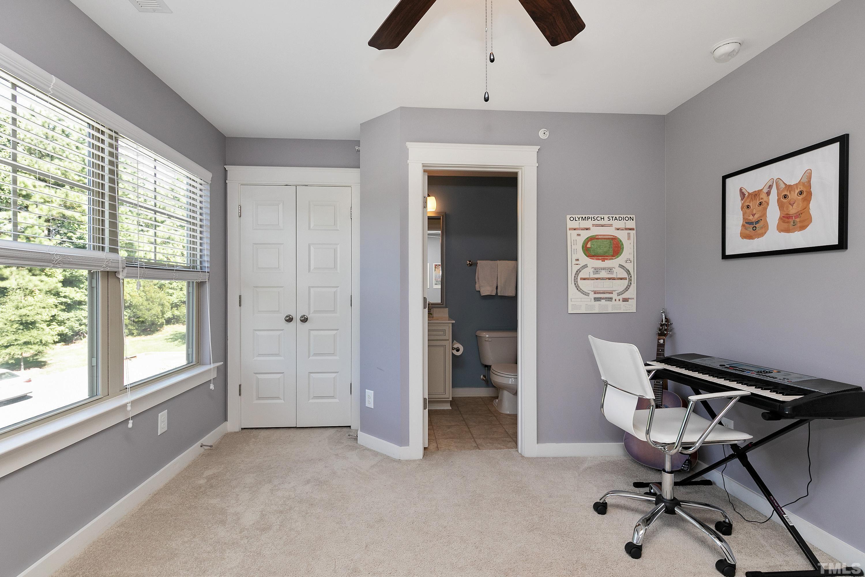 7906 Allscott Way Raleigh, NC 27612 - Photo 22 of 30 a view of a workspace with furniture and a window