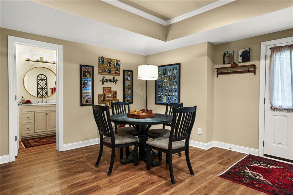 509 Crested Hawk Ridge Canton, GA 30114 - Photo 54 of 89 a view of a dining room with furniture and wooden floor