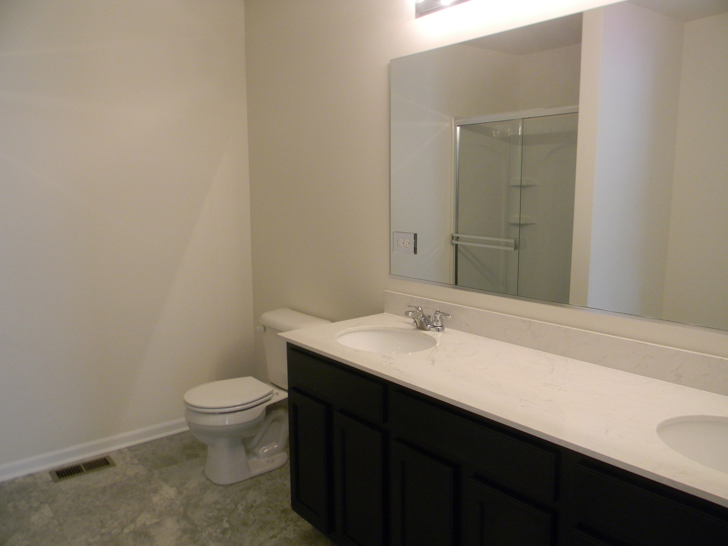 6616 Eich Drive Joliet, IL 60431 - Photo 13 of 20 a bathroom with a sink a toilet and mirror