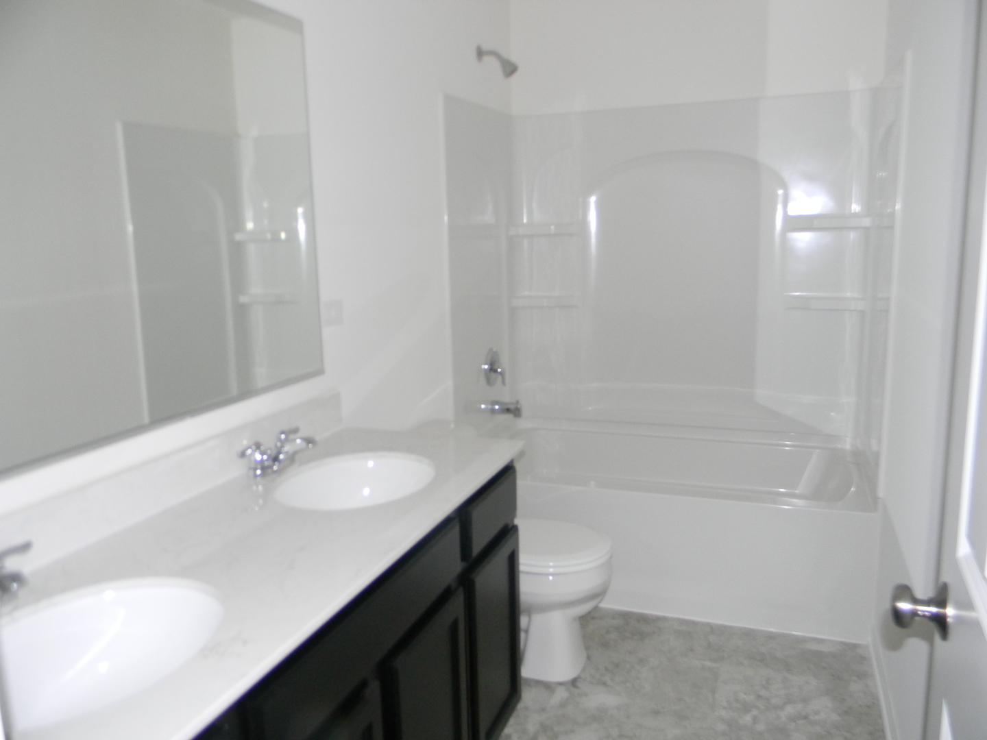 6616 Eich Drive Joliet, IL 60431 - Photo 16 of 20 a bathroom with a sink a toilet and shower