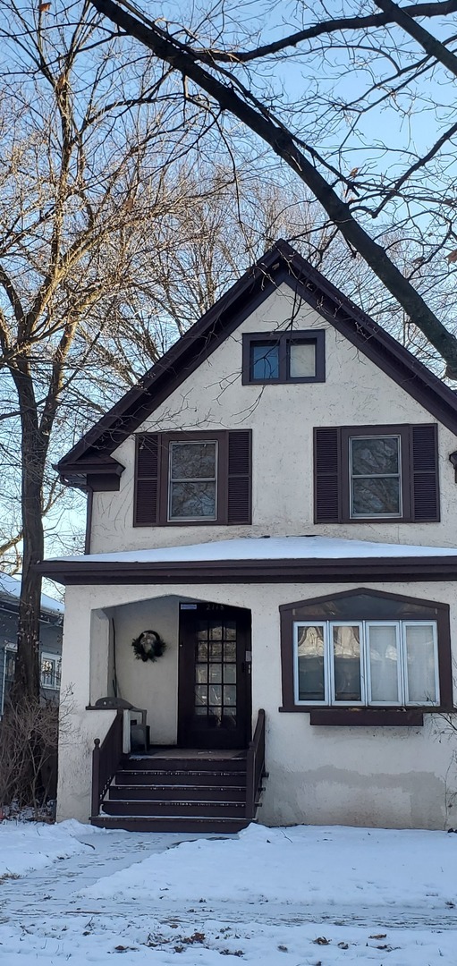 2118 Noyes Street, Unit 1 Evanston, IL 60201 - Photo 2 of 11 a front view of a house with a yard