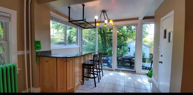 a view of a patio with a table and chairs