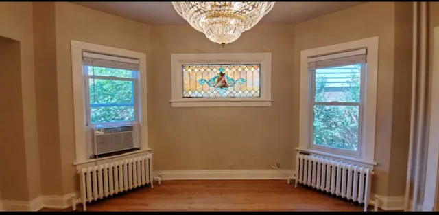 a view of an entryway door with wooden floor