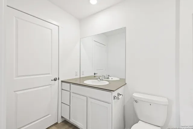 a bathroom with a shower a toilet and sink