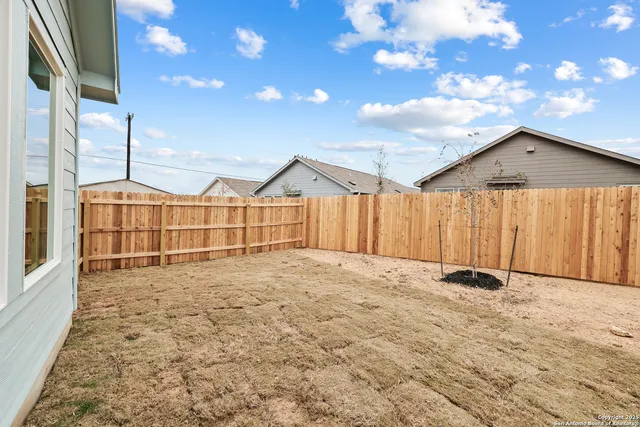 a view of a backyard of a house