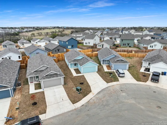 an aerial view of a house with a garden