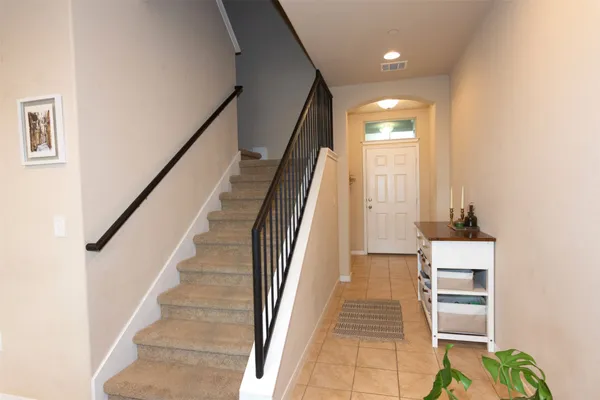 a kitchen with granite countertop stove and cabinets