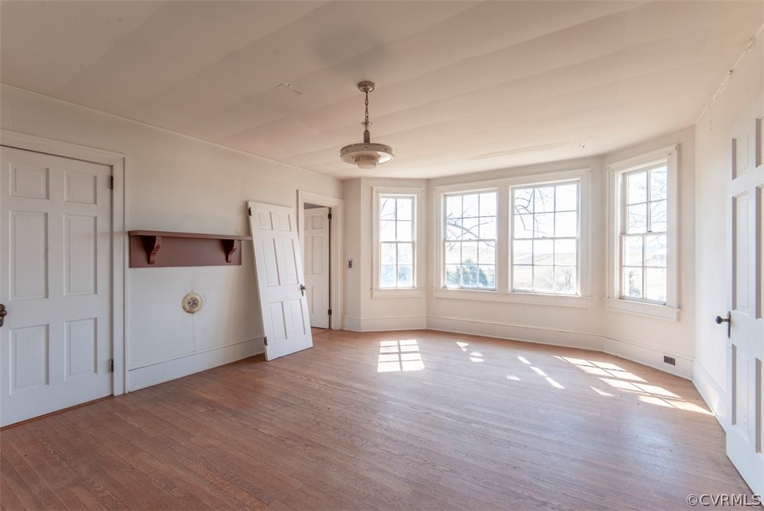 4010 West Hoover Road Reva, VA 22735 - Photo 17 of 50 a view of an empty room with a window and wooden floor