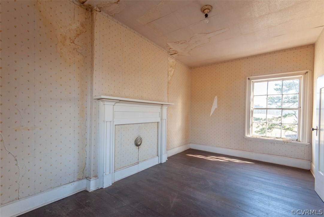 4010 West Hoover Road Reva, VA 22735 - Photo 25 of 50 an empty room with wooden floor and windows