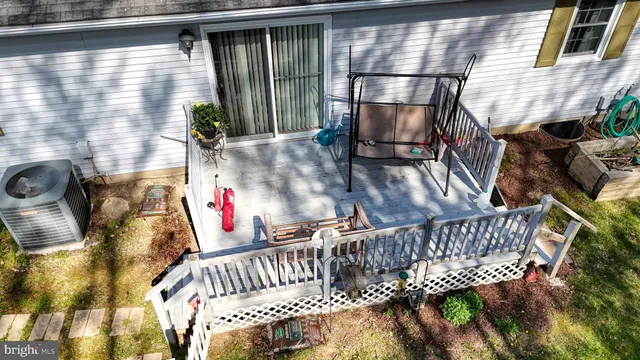 a front view of a house with a yard table and chairs