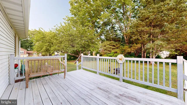 a view of house with backyard outdoor seating and plants