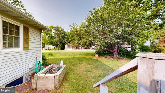 a view of a deck with table and chairs and wooden floor