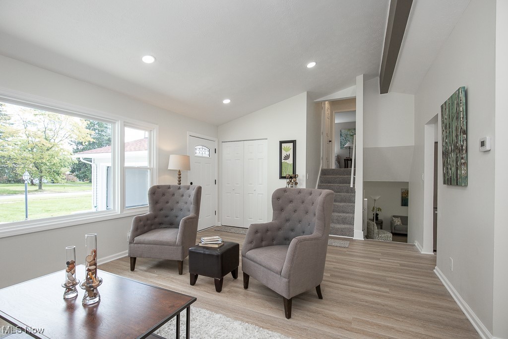 4670 Green Road Cleveland, OH 44128 - Photo 4 of 38 Living area featuring light wood-type flooring and vaulted ceiling