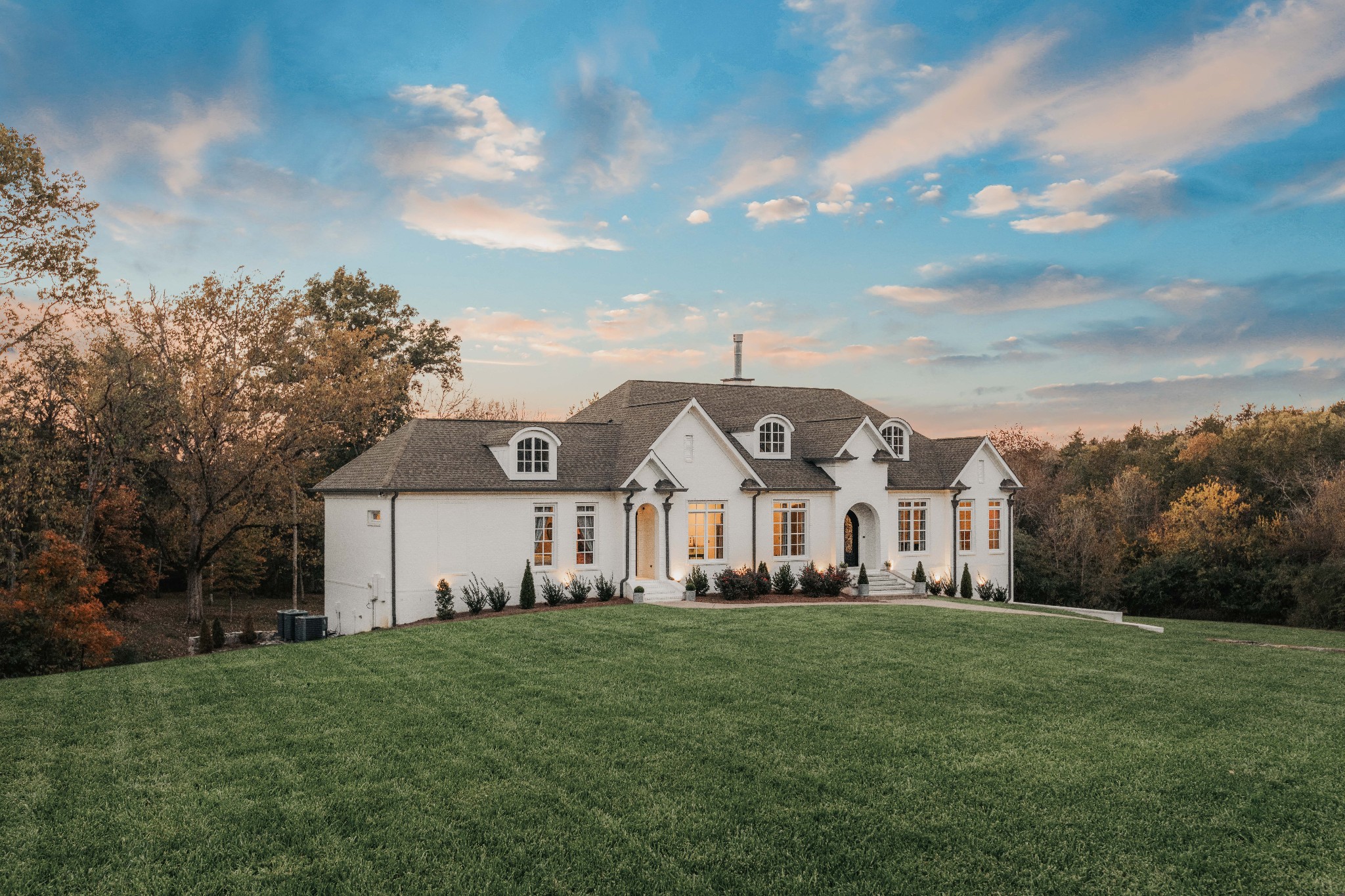 a front view of a house with a yard