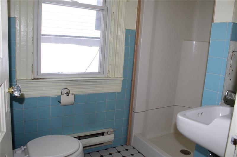 577 Linden Way Donora, PA 15033 - Photo 6 of 8 Tile bath with shower, shelves for linen storage